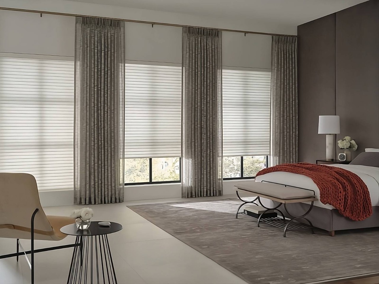 Hunter Douglas Sonnette® Roller Shades on tall windows in a modern but cozy bedroom at House To A Home Interiors near Springfield, Illinois